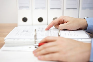 attorney is examining business documentation