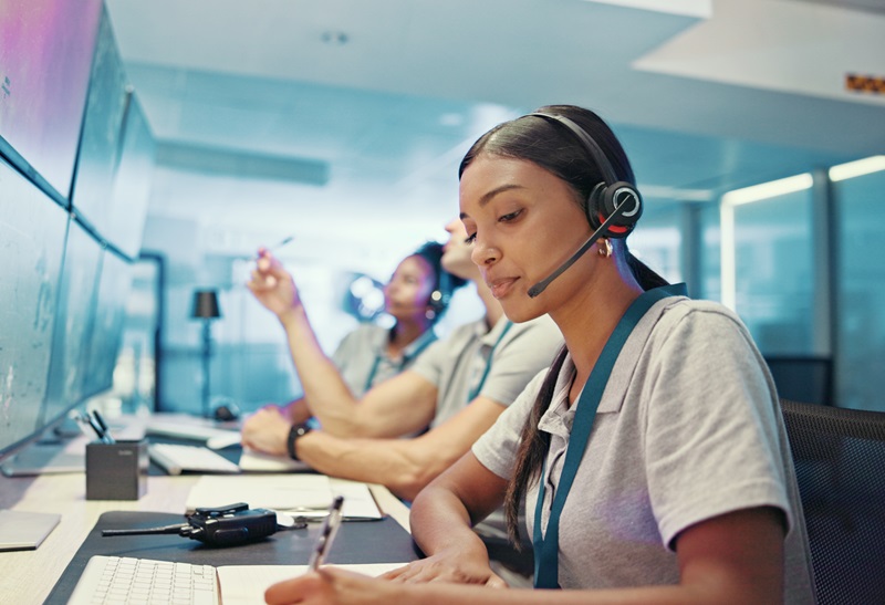 Computer, emergency service and woman with headset for security, dispatcher and operator. Telecommunication, surveillance office and first responder with monitor for incident report, contact and help