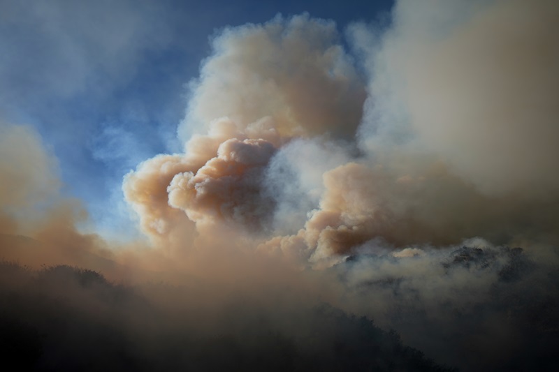 FILE - The Franklin Fire sends a plume of smoke into the sky, Dec. 10, 2024, in Malibu, Calif. (AP Photo/Eric Thayer, File)