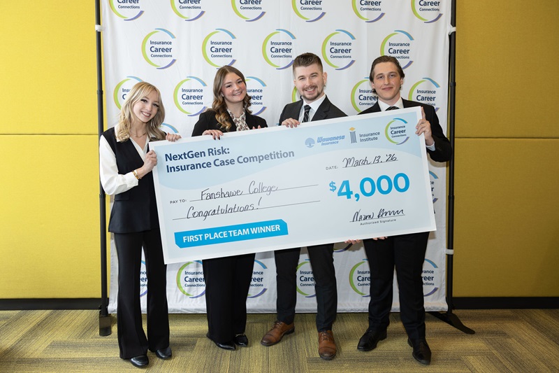 NextGen Risk case competition members representing Fanshawe College hold up a $4,000 cheque they won as an award