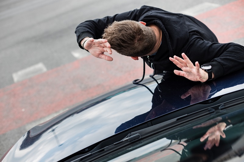 Traffic accident.Young man hit by a car