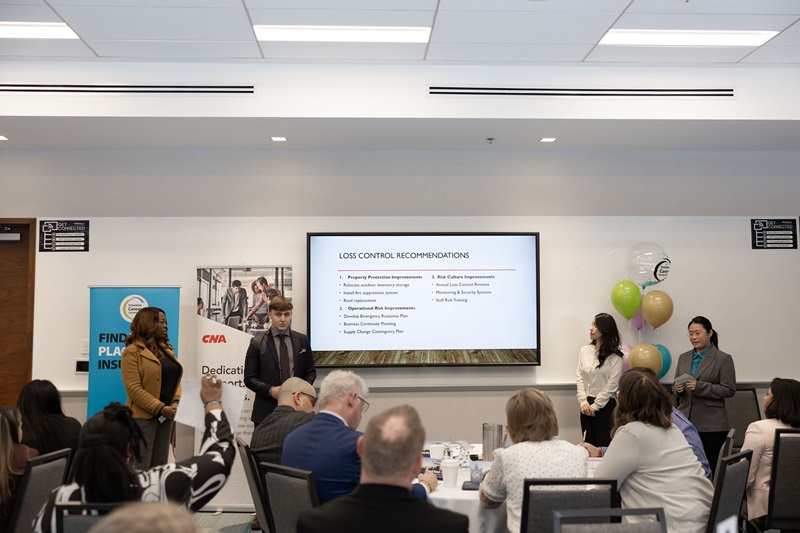 Seneca Team members give their final presentation in the NextGen Risk final round.