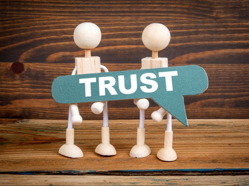 Trust speech bubble held between insurance partners